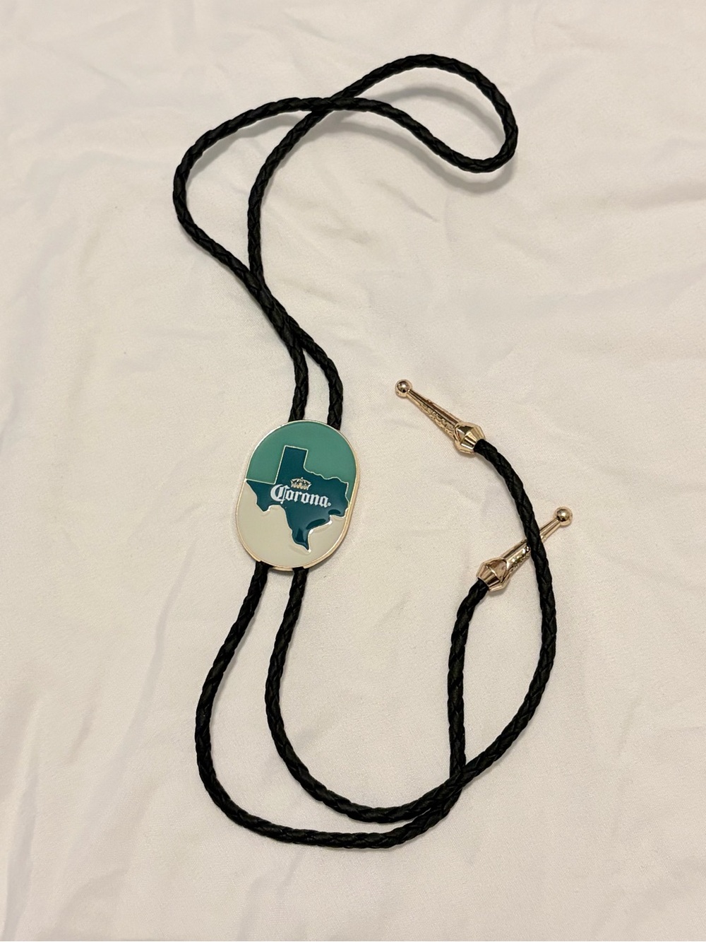 Corona Black Bolo Tie with Teal & White Texas Emblem